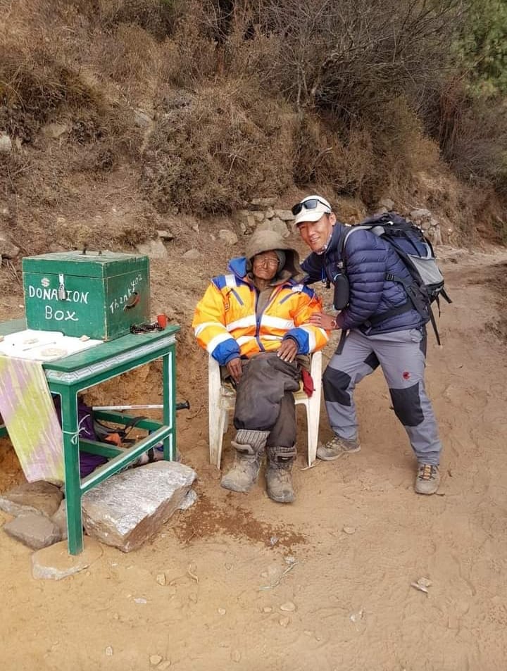 Chhiring D. Sherpa beside Pasang Lama’s donation desk in the Khumbu some time ago. Photo: Chhiring Sherpa/Facebook